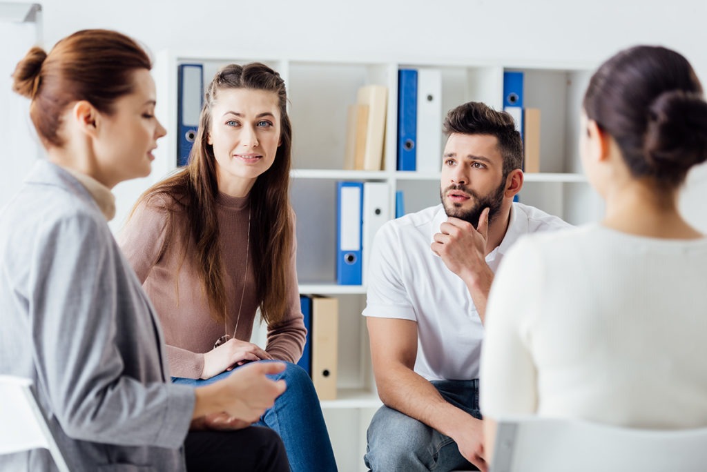 group of people talking about why people stop attending AA meetings