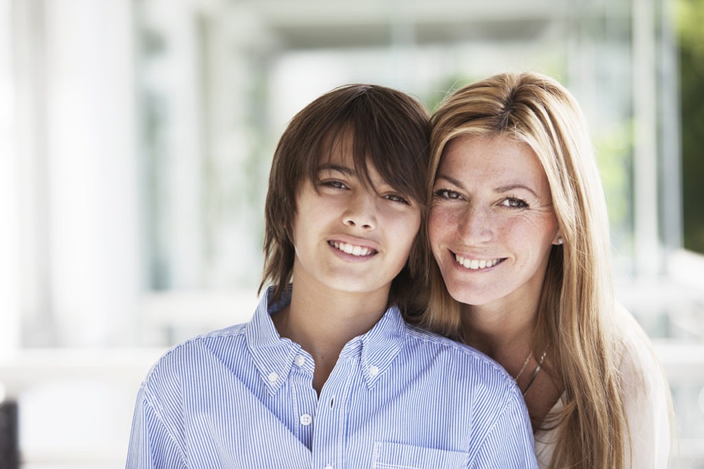 child and parent talking about parent's role in adolescent addiction