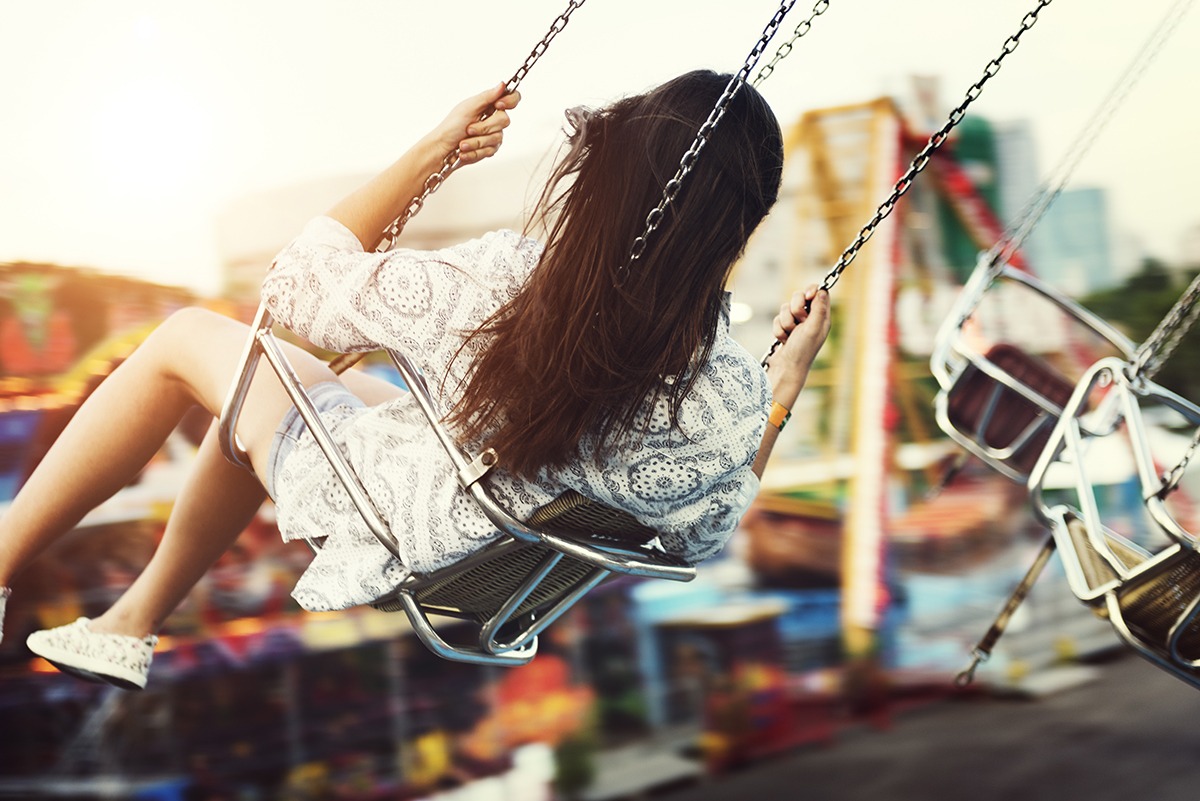 Woman Carnival Ride Riding Happiness Fun Concept