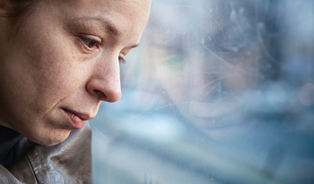 woman thinking about how to choose the right addiction treatment