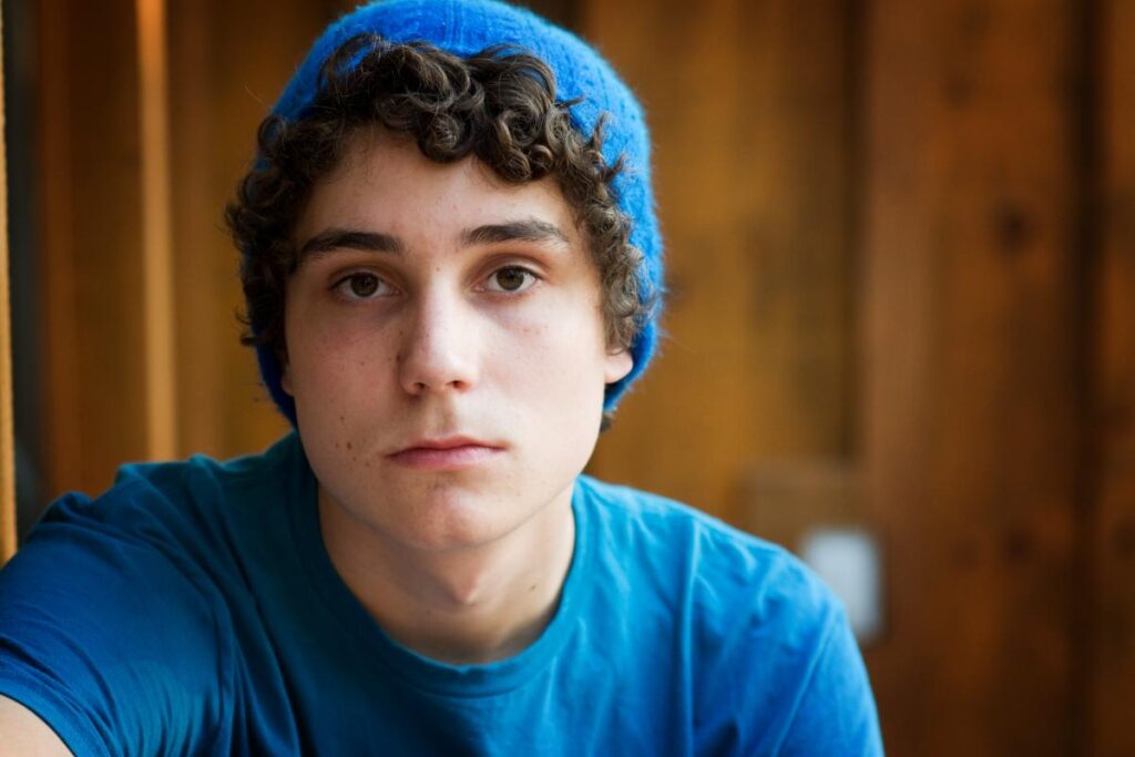 Teen in hat facing forward, struggling from teen steroid addiction