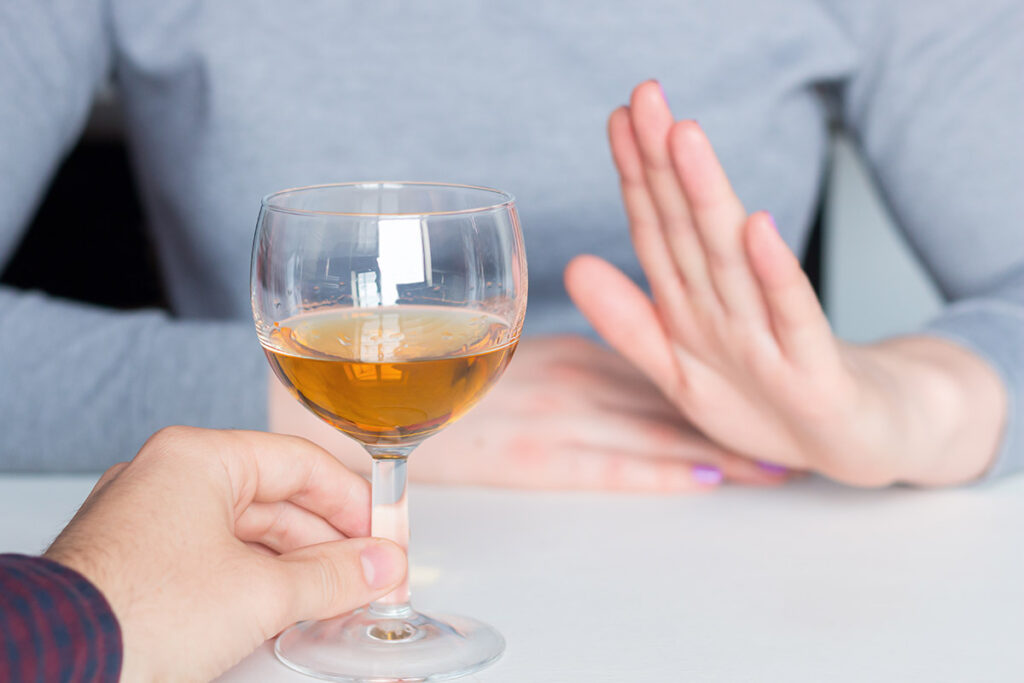 a person refuses a glass of wine which is one way to stop binge drinking