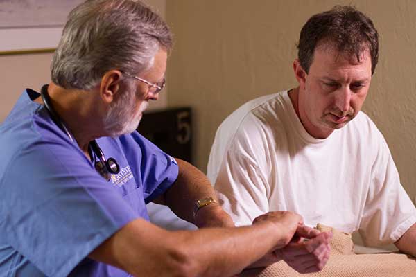 Man and doctor going over medical detox options