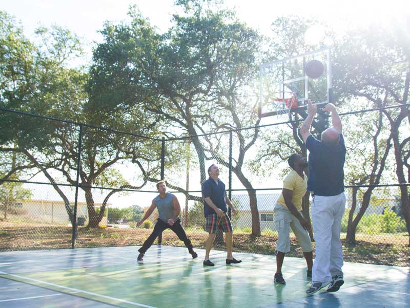 People playing basketball at the Right Step Hill Country
