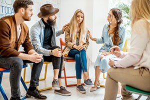 Therapist leading a group therapy program