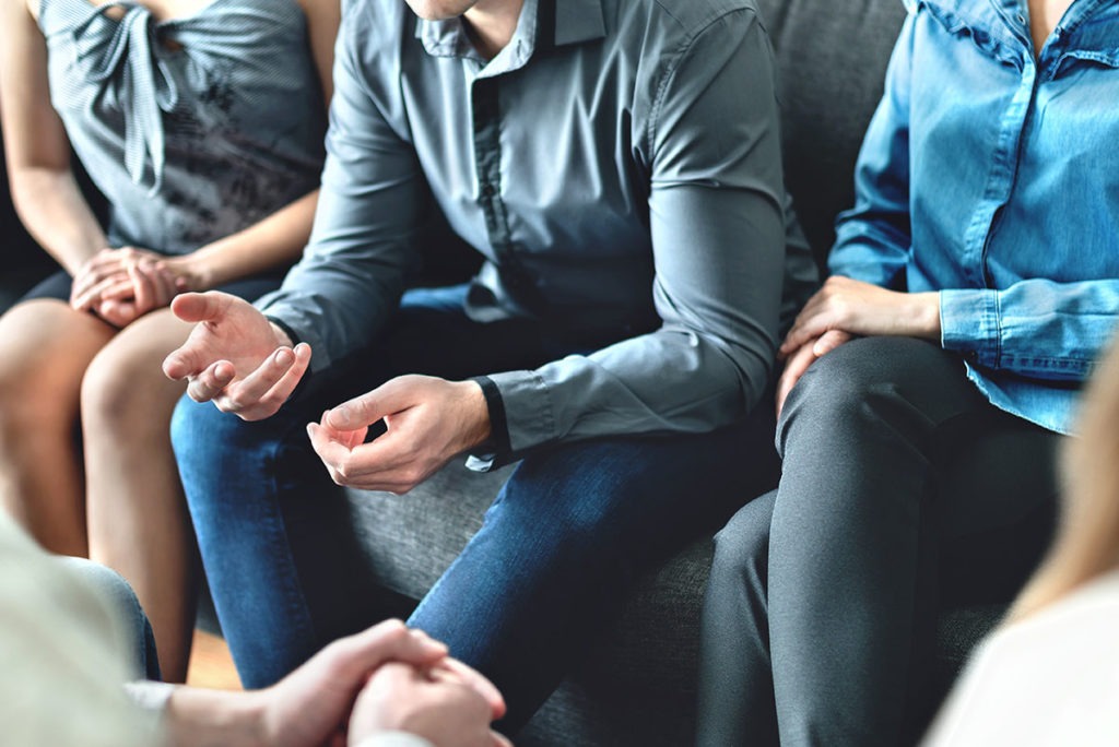 Group of people speaking at their Houston drug rehab centers