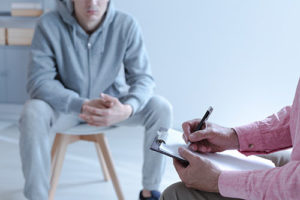 man undergoes individual therapy at an intensive outpatient program