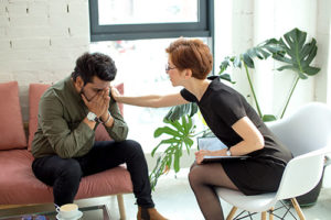 man at anxiety treatment centers texas receives counseling from an anxiety specialist at right step center