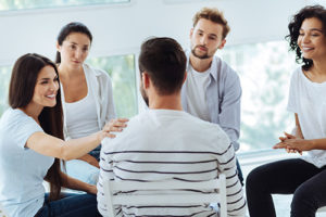 a woman holding out her hand at a texas addiction treatment center