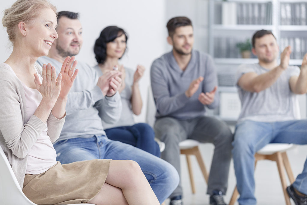 a group in a circle showing what is rehab like