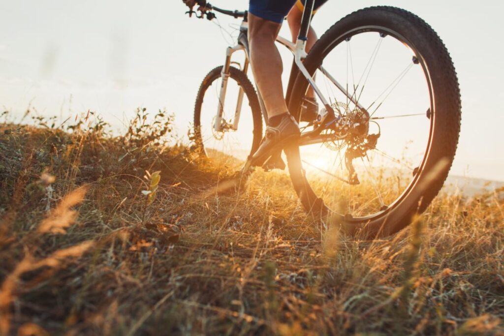 Person on bike learning about the best hobbies to help addicts stay sober