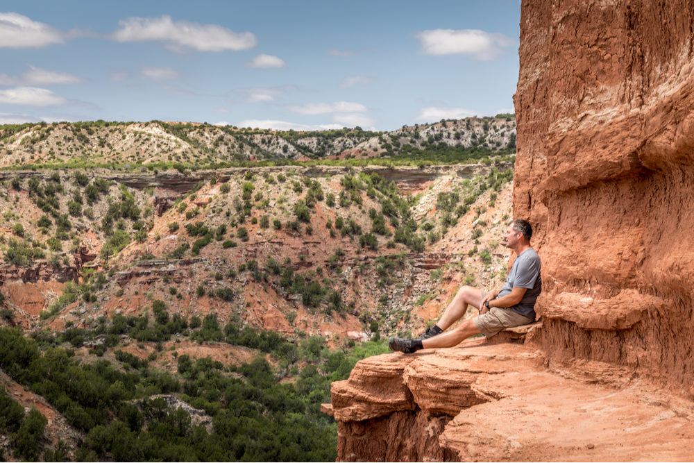 Man hiking during his recovery process overcoming obstacles and creating resilience