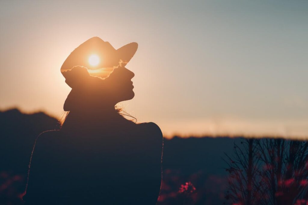 Woman outside feeling confident after undergoing CBT