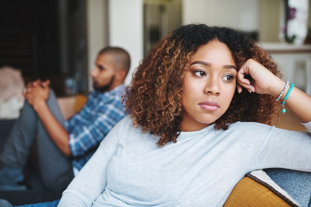 Woman wondering, "Can love addicts have healthy relationships?"