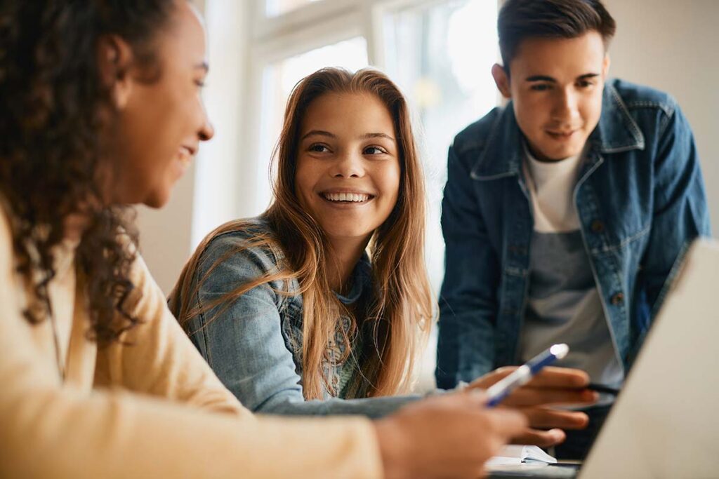 a group of teens smile and chat about Xanax use and teens
