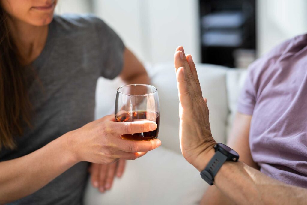 a person refuses a glass of liquid to show how do I slow down drinking