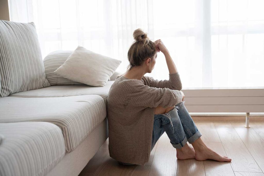 Person thinking about their defects of character