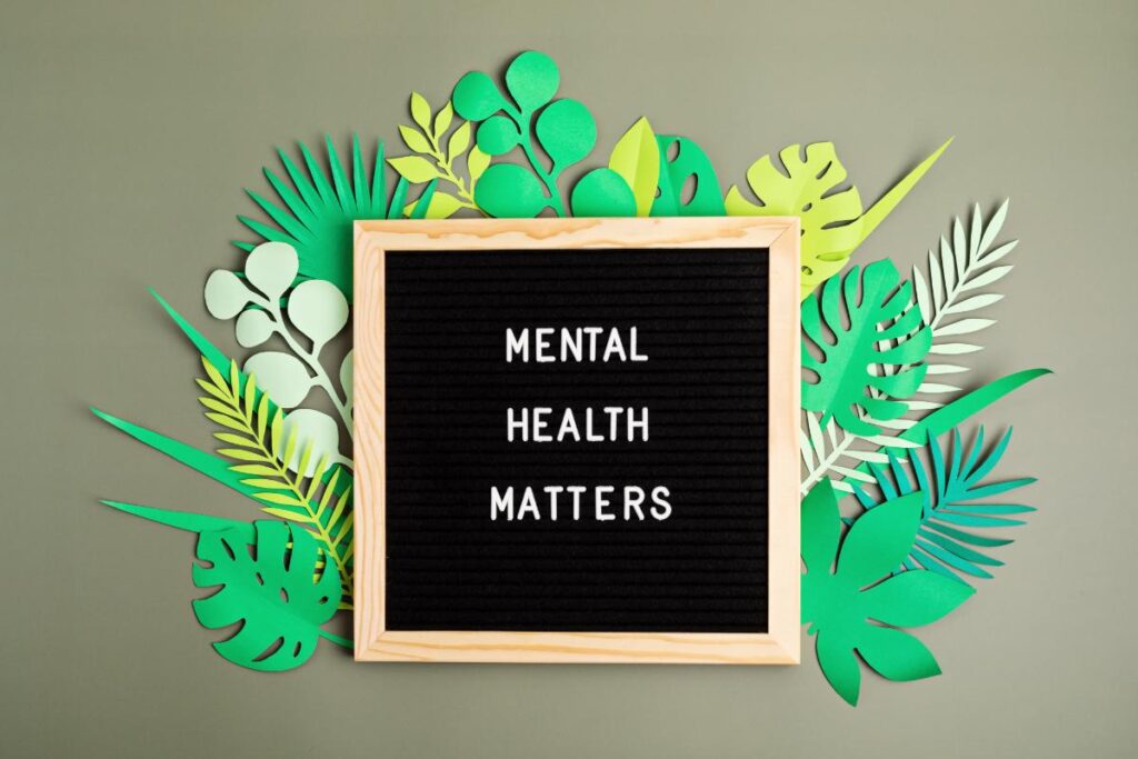 a sign that says mental health matters for mental health awareness month