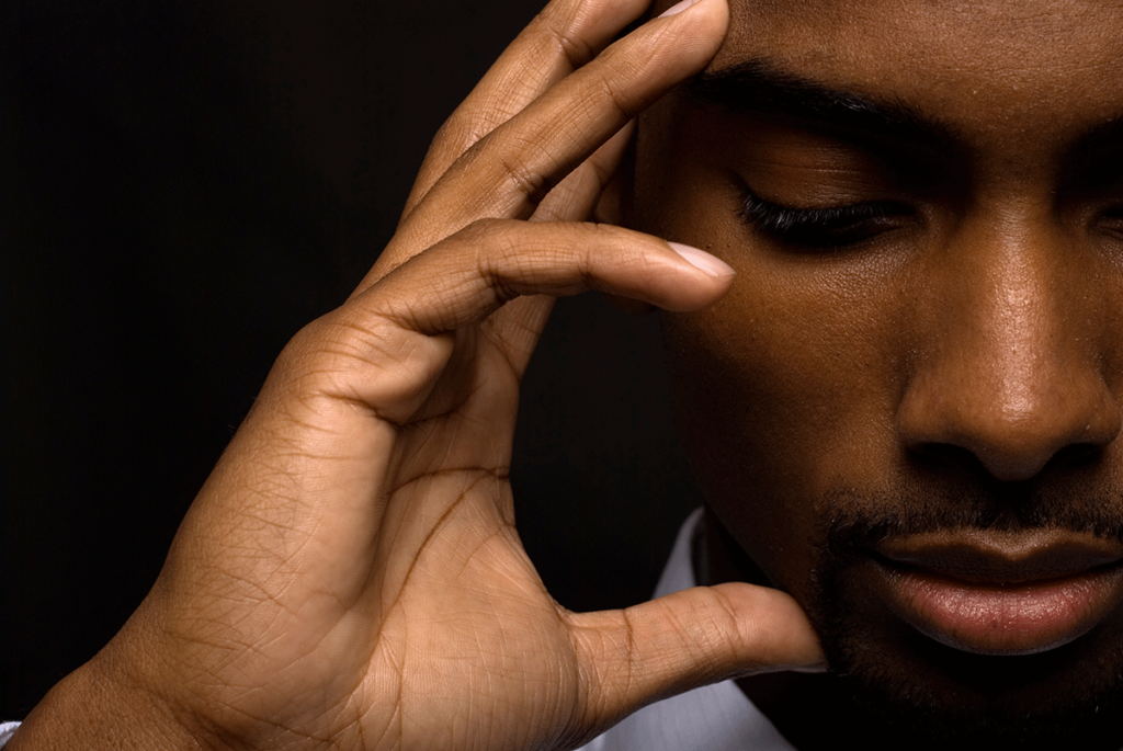 Man puts hands up to face, wondering what is drug induced amnesia