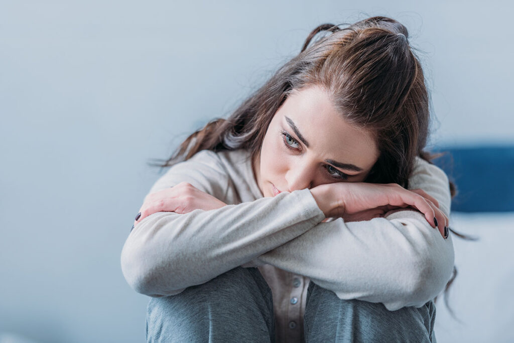 A woman wondering, "Is cocaine a stimulant?"