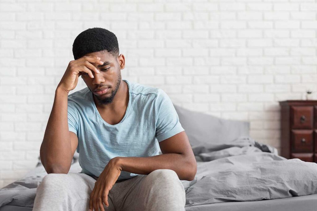 Person struggling with the effects of using both Xanax and alcohol